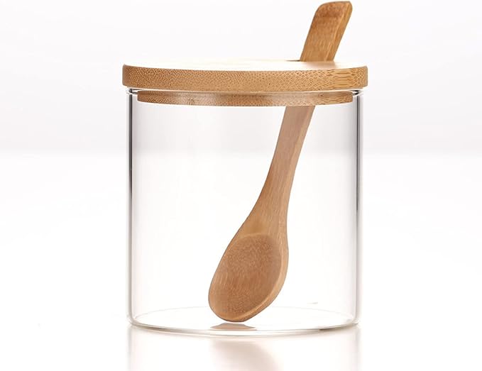 Single clear glass jar with bamboo lid and wooden spoon